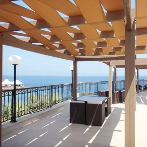 WPC pergola with fabric stripes