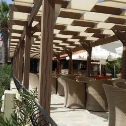 WPC wall pergola with fabric stripes